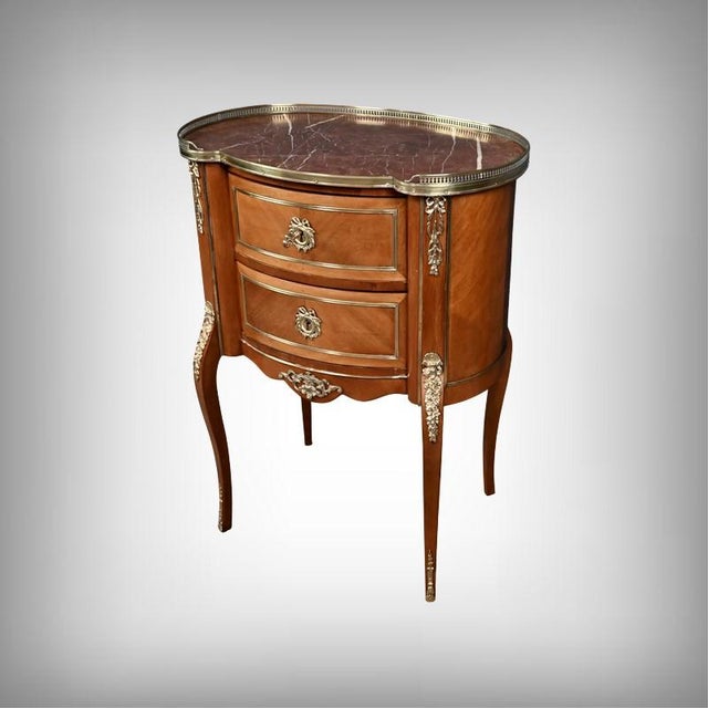 This elegant mahogany and mahogany veneer commode, crafted in the early 20th century in the purest spirit of the...