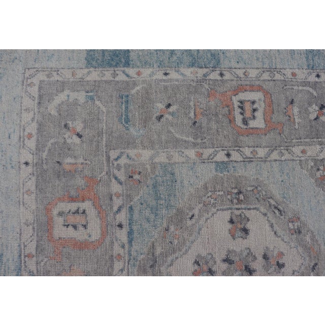 Orange All-Over Tribal Motifs Design Light Blue With Hints of Orange Turkish Oushak Rug For Sale - Image 8 of 12