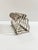 An unusually sculptural silverplate toast rack featuring a distinctive pear-inspired silhouette and elegant openwork...