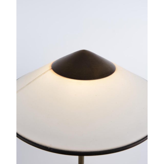 Niels Thykier Kongelys table lamp in brass with off-white shade. Classic Danish design with an elegant and functional...