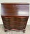 This is a vintage Chippendale-style mahogany secretary desk featuring a slant front, fall front, or drop front writing...