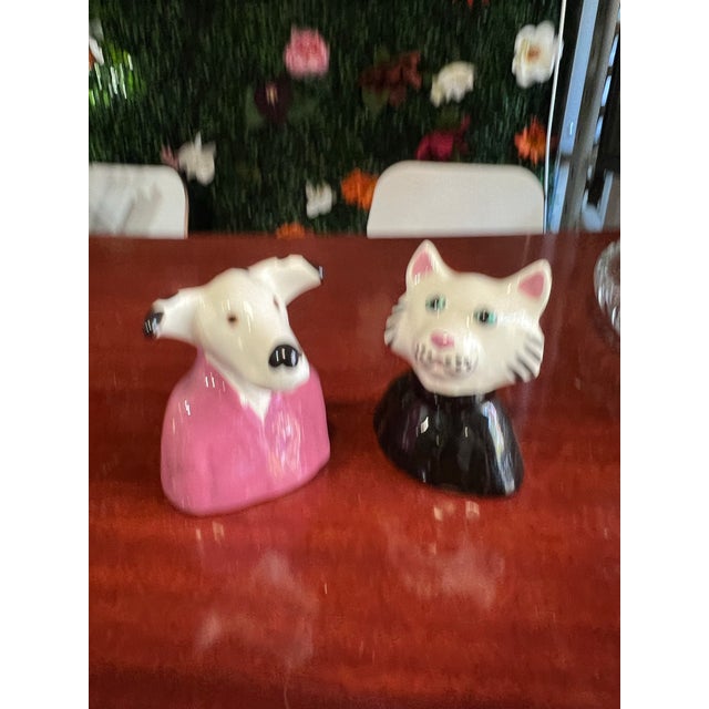 Up for consideration is a beautiful vintage pair of ceramic cat and dog salt and pepper shakers. These would look lovely...