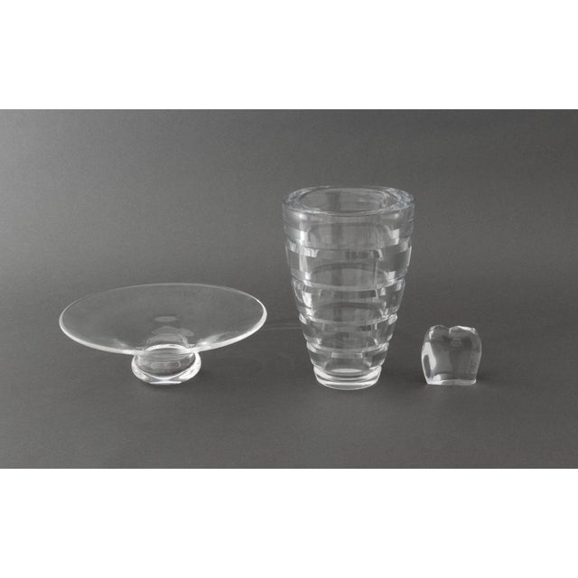 Three Clear Crystal Vessels, comprising: Baccarat elephant paperweight, acid-etched mark to the underside, cut-crystal...