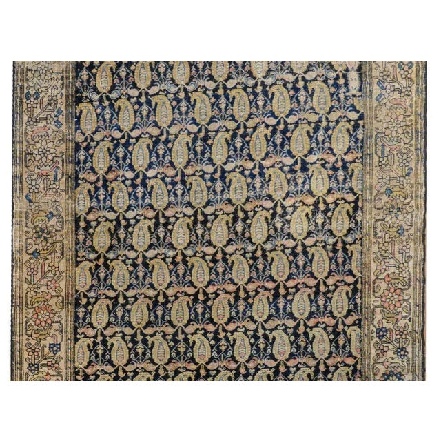 A wonderful early 20th century Persian Malayer rug with an allover paisley and petite floral pattern woven in pale green,...
