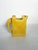 Yellow glazed ceramic pitcher, made in France circa 1970. Its geometric and architectural silhouette—rectangular body,...