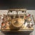 Set includes…3 glass decanter for Bourbon, Gin, and Vodka; 6 glasses; 1 shot glass; 1 ice tong; glass ice bucket with...