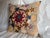 A one-of-a-kind pillow crafted from a 1900s Suzani textile. This Central Asian embroidery features bold floral motifs and...