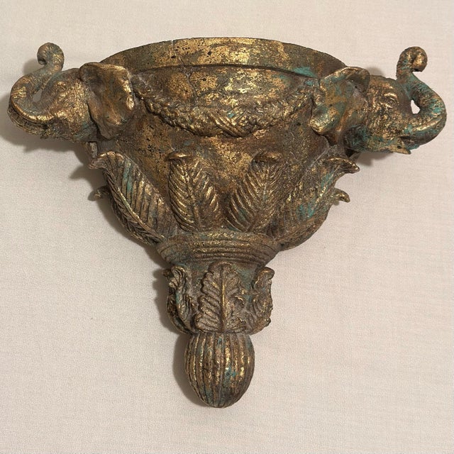 Make a dramatic statement with this striking pair of newly painted, hand-gilt double elephant head wall sconces,...