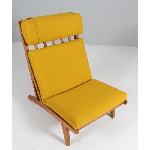 Hans j. Wegner lounge chair with loose cushions new upholstered with yellow hallingdal wool fabric. Frame of oak. Model...
