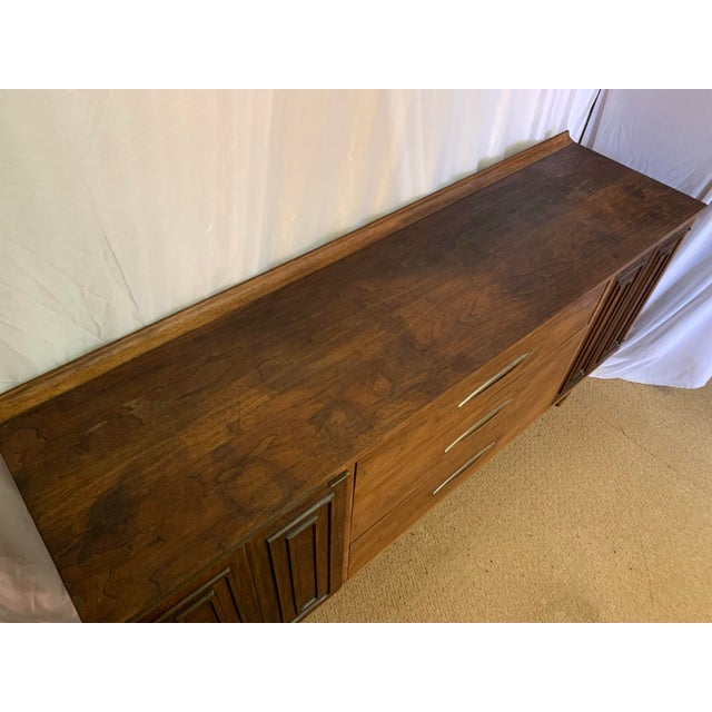 Solve all of your storage needs in style with this iconic Sculptra line piece of mid century modern furniture by Broyhill....
