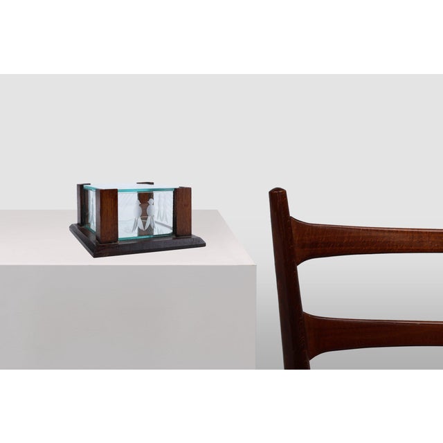 An elegant jewelry box in facet cut glass with oak wooden frame, handcrafted in France in the 1930s. The jewelry box has a...