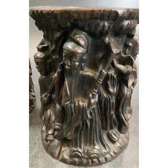 Intricate pair of antique hand-carved wooden brush pots with a dark brown finish. Each pot has detailed high-relief...