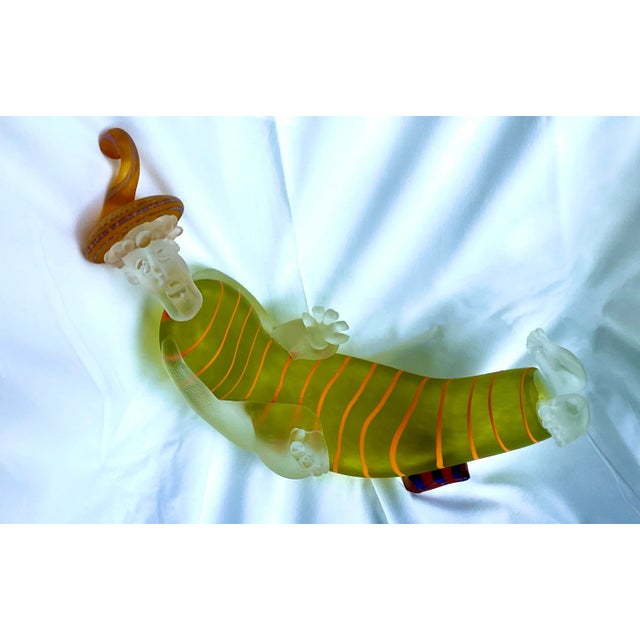 This is a wonderful piece of art glass. At one time he was most likely sitting on a base that as since disappeared or been...