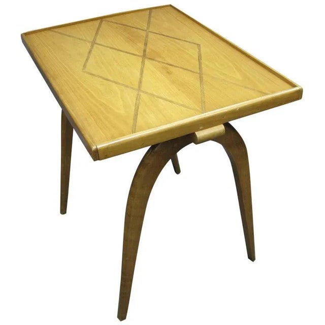 A fine Belgian sycamore side table resting on sabre legs. The rectangular top inlaid with a typical diamond pattern...