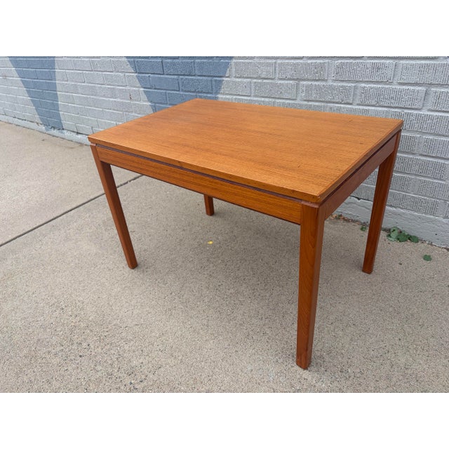 A beautifully crafted Mid-Century Modern side table attributed to Heggen of Norway, showcasing the clean lines and warm...