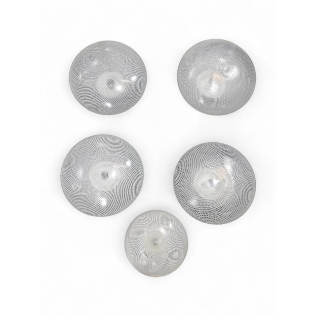 5 Venini Glass Murano pendant lamps from the 1950s in excellent condition. 4 ceiling lights have the same size while 1 is...