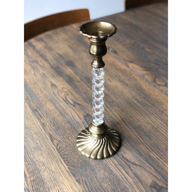 A tall vintage lucite and brass candlestick holder. Standing over a foot tall this striking candle holder makes a...