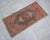 an Vintage small rug. Medium wood background color yastik rug perfect for a small guest bath or in front of the kitchen...