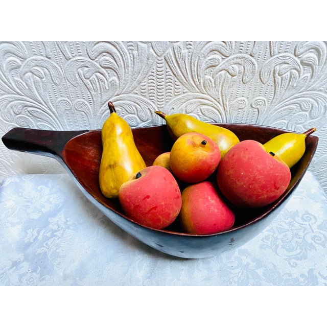 An absolutely beautiful mid century carved wood deep leaf shaped bowl and 8 pieces of painted wood fruit. A gorgeous...