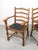 Quality oak chairs with striped leatherette in the sitting area.