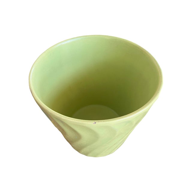 We have for your consideration a Bauer pottery swirl planter. planter consists of a green color that is gorgeous. This...