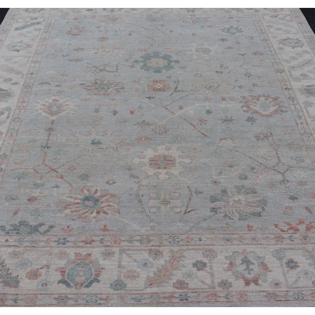 Modern Tribal oushak with muted background in wool with all-over design Keivan Woven Arts; rug AWR-9008 Country of origin:...