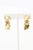 This is part of Chairish’s Costume Jewelry assortment. These dynamic pair of signed Fallon pierced dangle drop earrings...