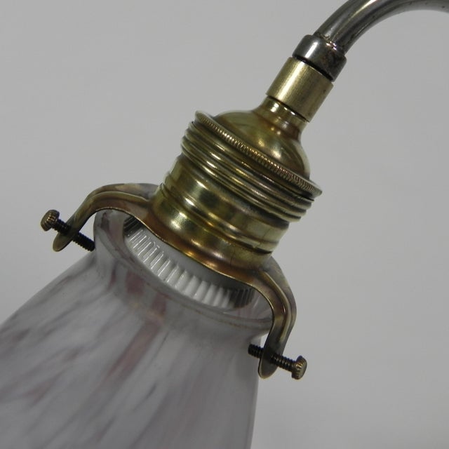 The shade can be turned in all directions. an ingenious spring system in the hinge ensures that the lamp remains fixed at...