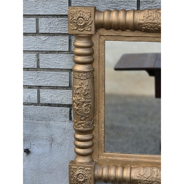 This 19th century American federal gilded hallway wall mirror is a stunning piece of antique décor. With a classic...