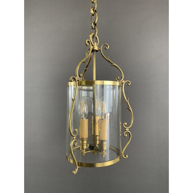 Neoclassical Pendant Light in Brass and Glass Admire this remarkably refined neoclassical pendant light, a centerpiece...