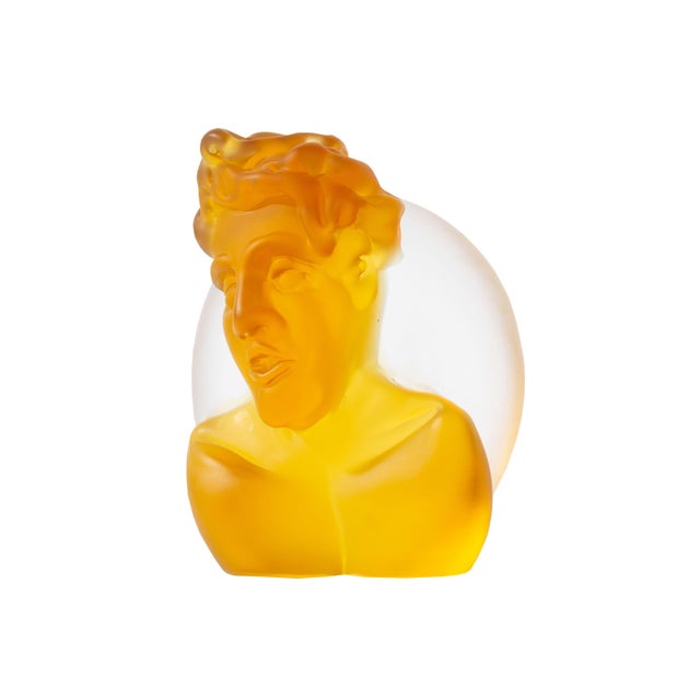 A 2004 art glass sculpture by the American glass artist Richard Jolley (born 1952). This work depicts an amber bust of a...