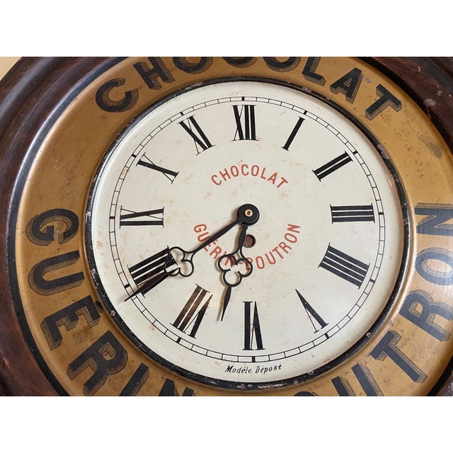 A unique clock that hung throughout the café and was used as an advertising sign for the Guerin Boutron Chocolat brand....