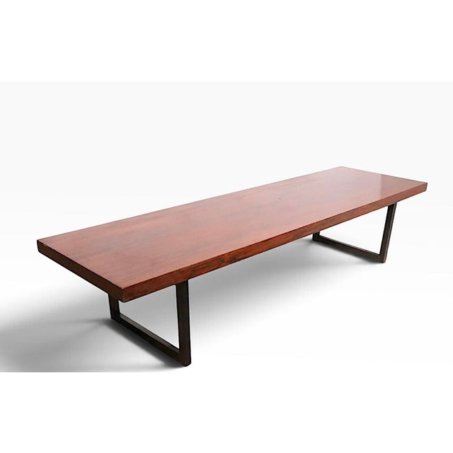 Chic architectural design Mid Century Danish Modern coffee table, constructed of Rosewood veneer and sold wood. The...