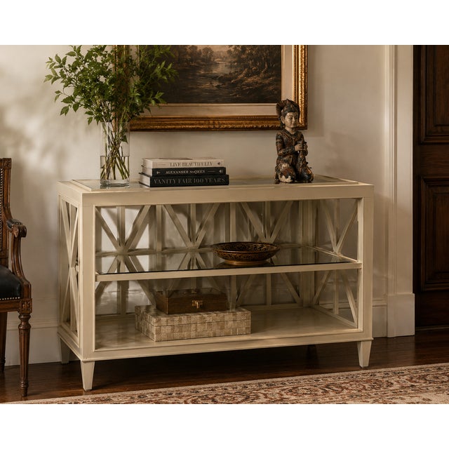 Elegant taupe-painted wood console attributed to Barbara Barry for Henredon, featuring a mirrored back, a central glass...