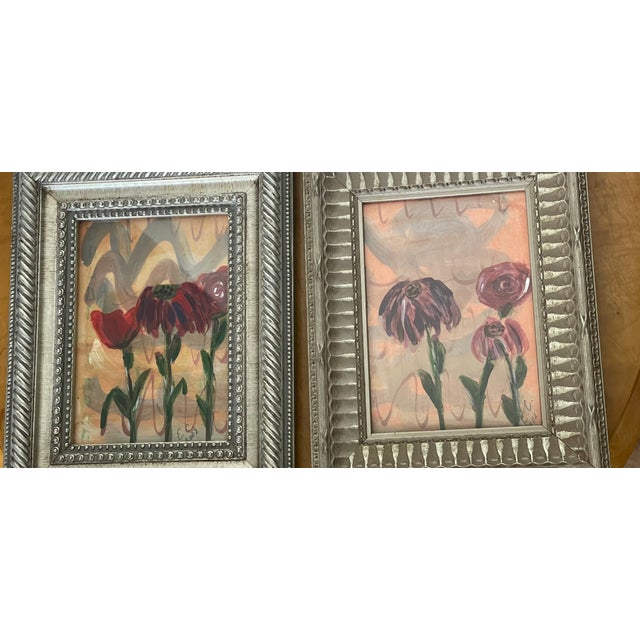 Beautiful pair of abstract modern floral paintings in ornate silvered frames. Acrylic on white paper, signed lower right.