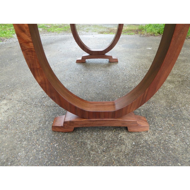 A modern open designed desk in walnut flaming feather crotch burls, book matching throughout. . A lightly used piece from...