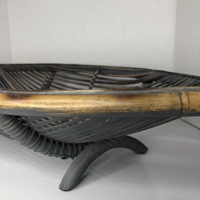 Bring natural warmth and timeless style to your home with this **Vintage Mid-Century Modern (MCM) Pencil Reed Rattan Canoe...
