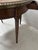 Louis XVI style bouillotte table in veneered wood It rests on four fluted legs The top is a breccia marble slab surrounded...
