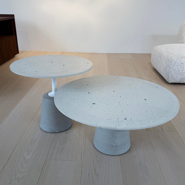 Set of Two Rock Mini Side Tables by MDF Italia with white chip tops and natural cement bases. Small Table Diameter: 23...