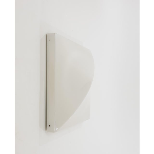 Wall lamp designed by Ennio Chiggio and produced by Emmezeta in the 1970s. The lamp consist of two parts; a metal...