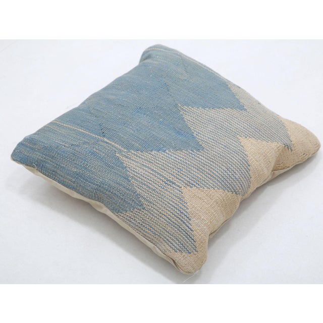 A one-of-a-kind handwoven Afghan wool kilim accent pillow featuring large two-tone zigzag chevron. Cut and sewn by hand...