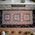 This vintage hand-knotted Oushak rug showcases a delightful blend of pastel tones and geometric precision, perfect for...