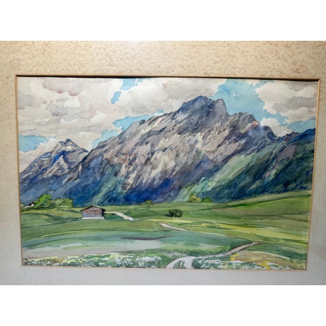 Original Watercolor Painting by Fritz Wucherer of Alpine Mountain Range & Cabin Landscape for your consideration. The...