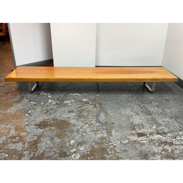 Design Plus Gallery presents a Vintage French Low Wood Table with Chrome Supports. The thick wood top has rounded corners,...