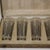 Set of six Rene Lalique Glass 'Six figurine' Shot glasses, in their original presentation box. The glasses have grey...