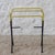 Vintage towel rack. Tubular metal frame coated in black and pastel yellow plastic with silver details. Composed of three...