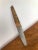 A beautiful vintage triangular cutting board and knife set, designed and made by Carl Auböck in the 1950s. The board is...