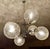Mid century pendant light, chrome structure with intertwined curved chromed spokes and bubble glass shades height 31.49...