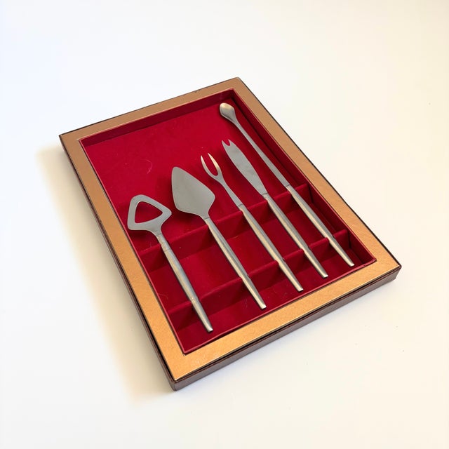 A mid century 5 piece bar tool set by Kalmar Designs. Made of stainless steel in Italy. Each piece is marked by the...