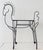 A vintage wrought iron bar cart in the shape of a pony. The piece is on casters with glass top shelf. For use as a bar...